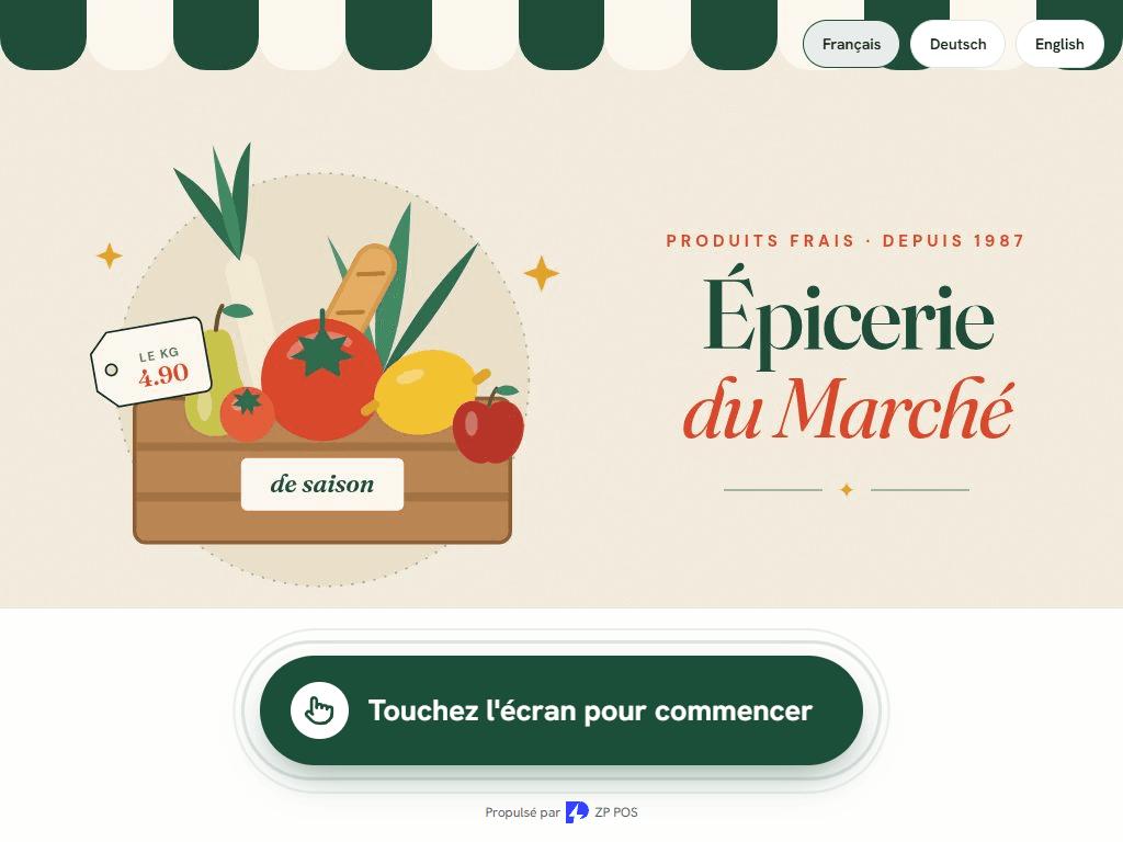 Caisse tactile de l’épicerie passée en mode borne : écran d’accueil paysage avec une cagette de légumes, bouton « Touchez l’écran pour commencer » et choix de la langue.
